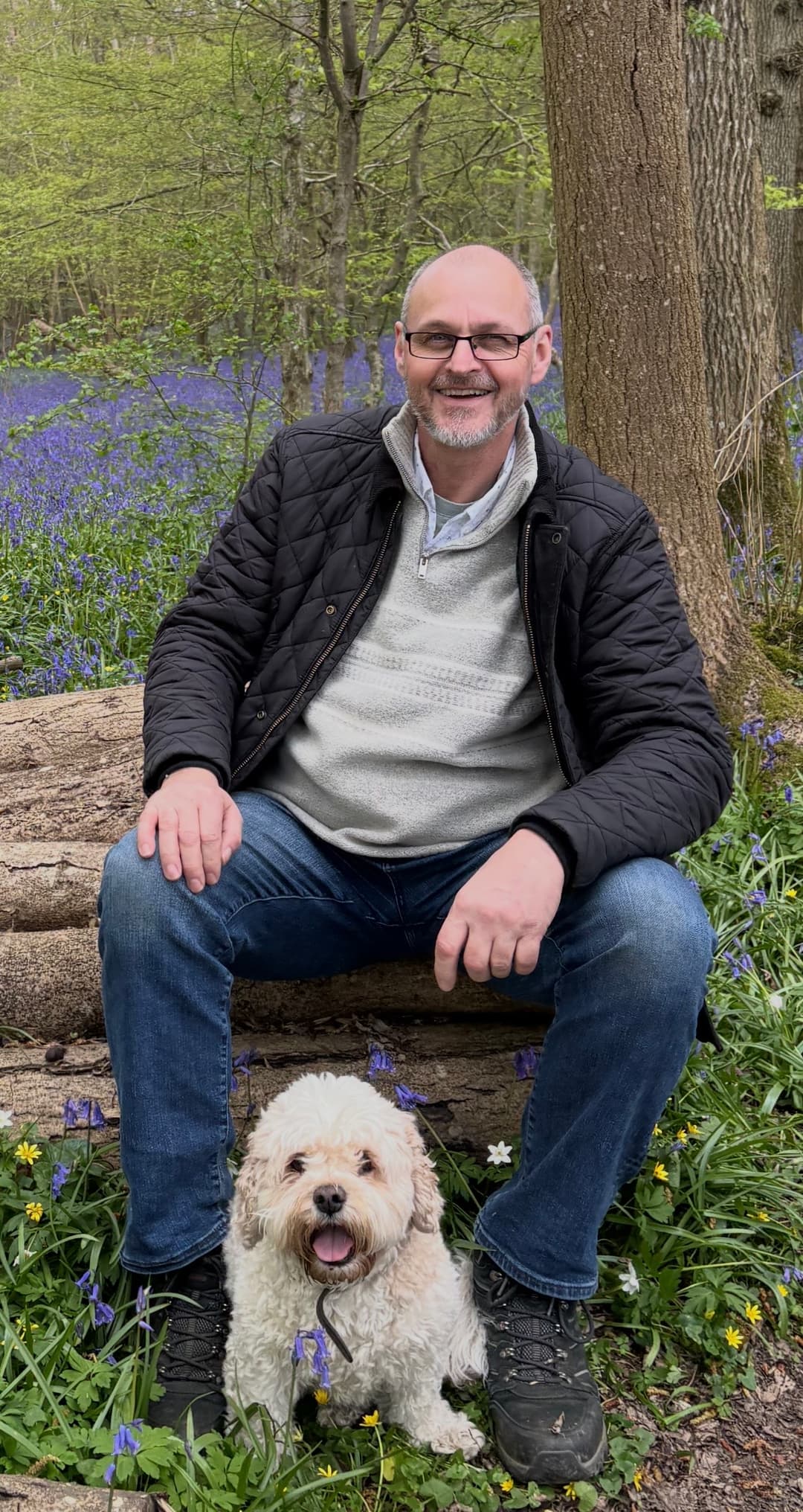 Tim Riley outdoors with his dog